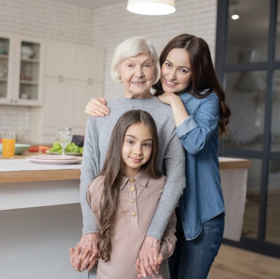 Senior Care Placement guidance supporting multigenerational family relationships as grandmother, mother, and child share time together at home.